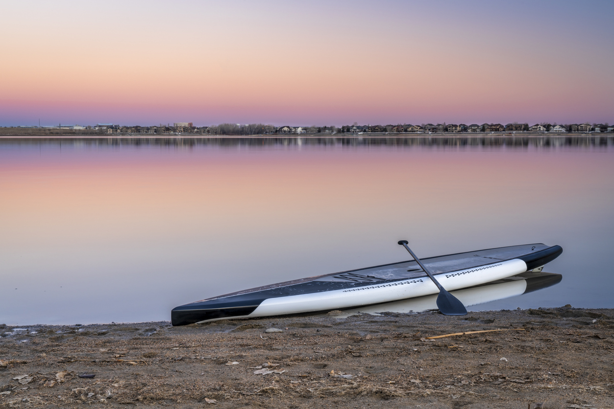 Dusk over lake with a paddleboard