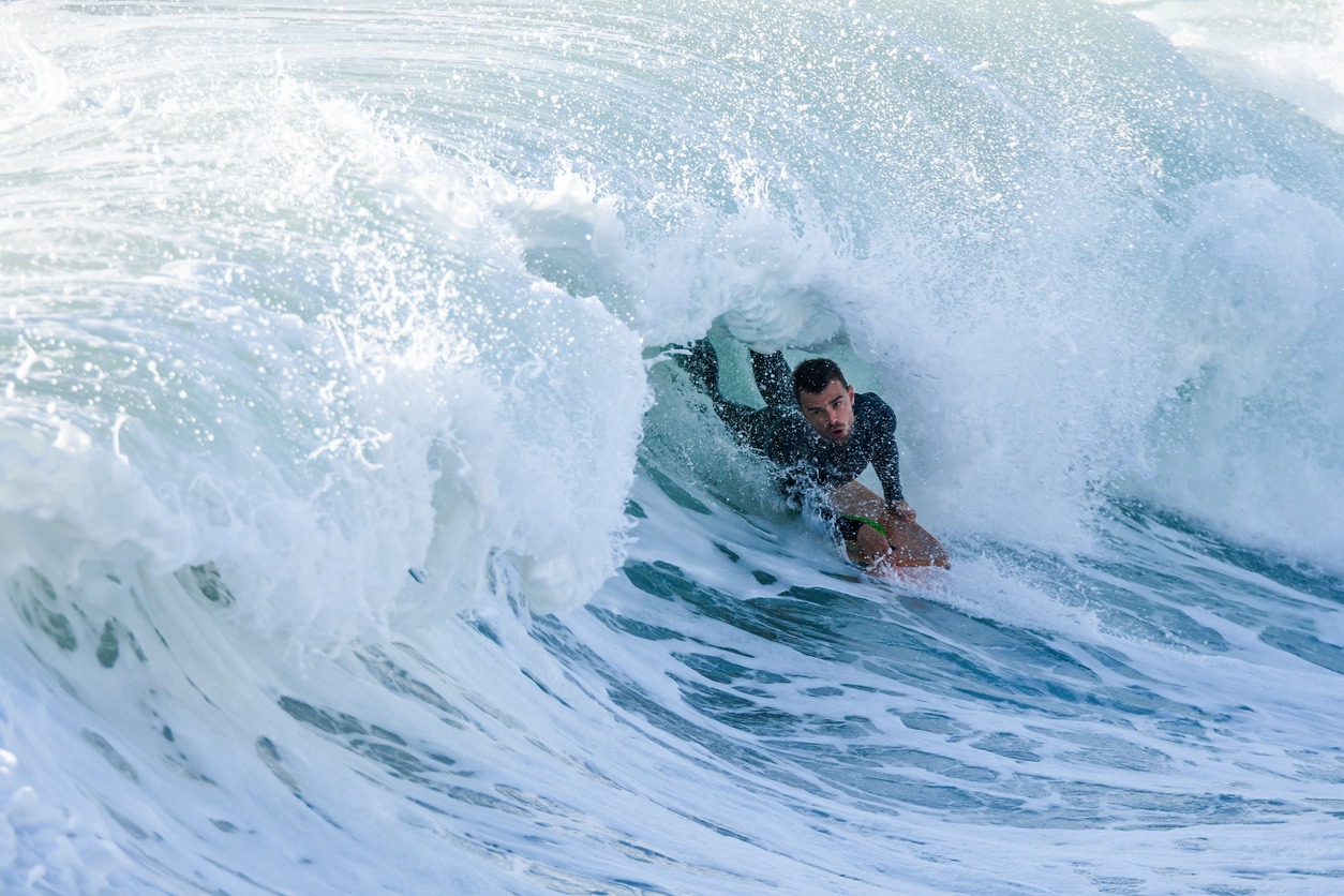 Bodyboarder surfing ocean wave