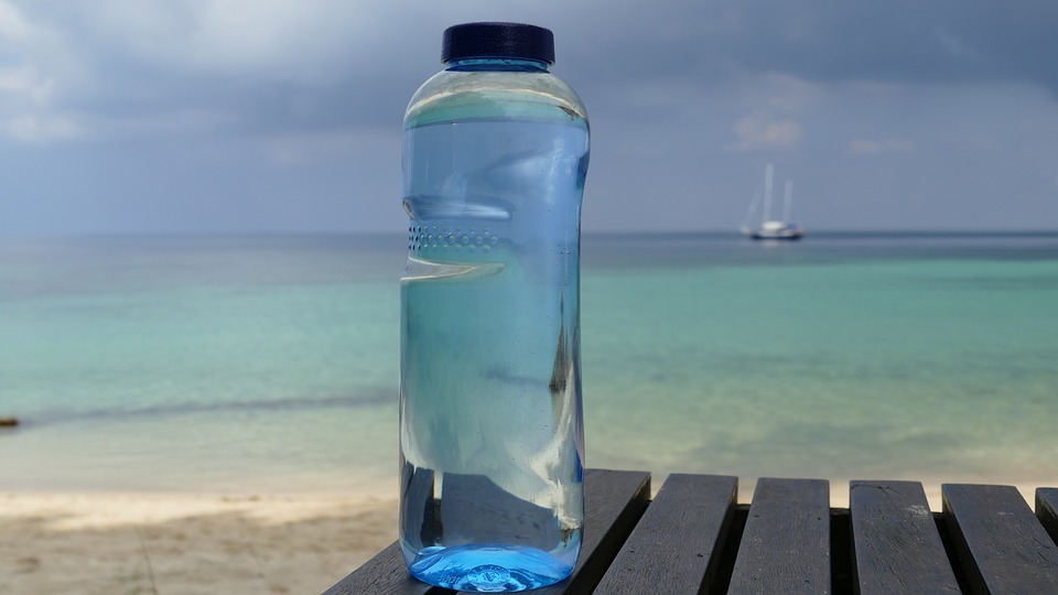 a water bottle by the ocean