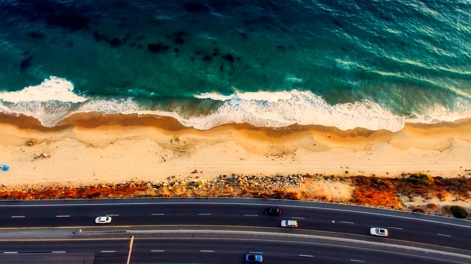 an aerial view of Laguna Beach by the highway