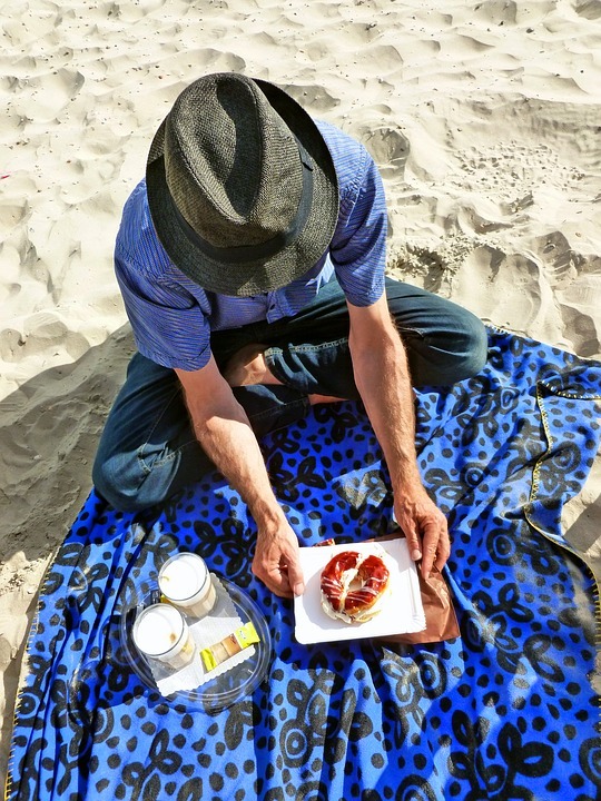man having a picnic at the beach