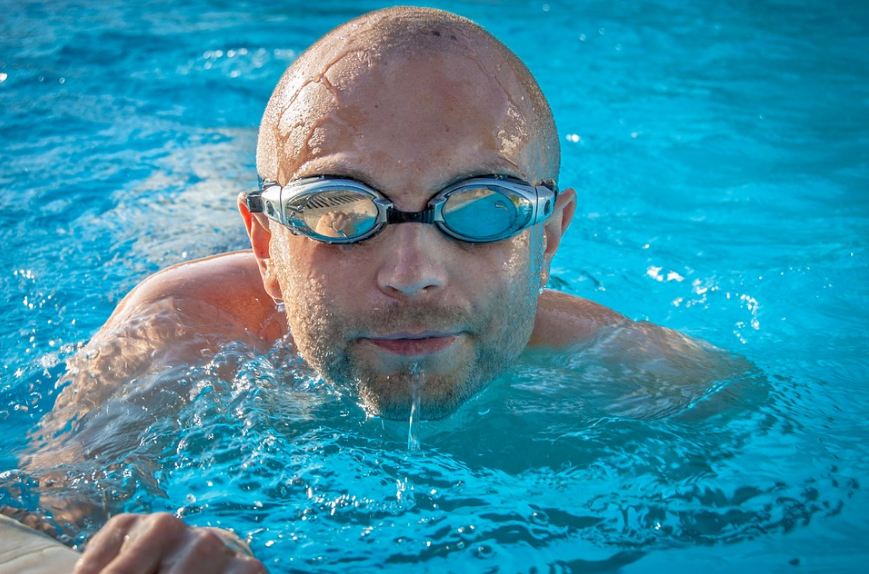 man in the pool wearing goggles