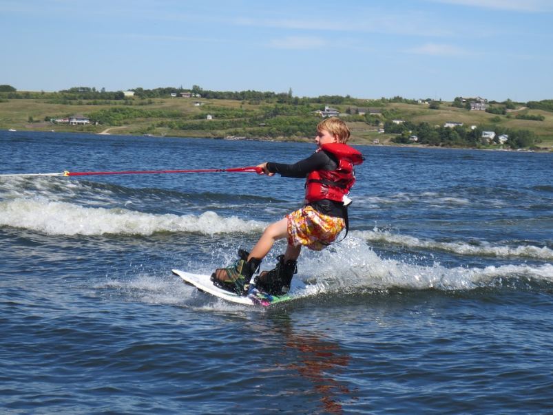 A child starting to learn wakeboarding