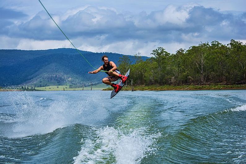 A man doing a wakeboarding jump