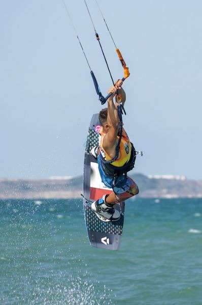 A kitesurfer on a board