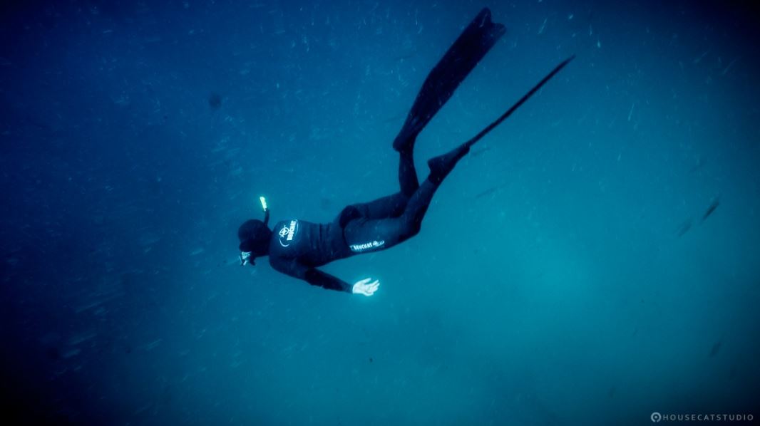 A man snorkeling in cold, deep waters