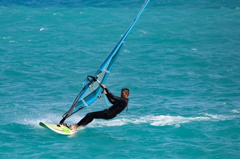 A man windsurfing in the sea