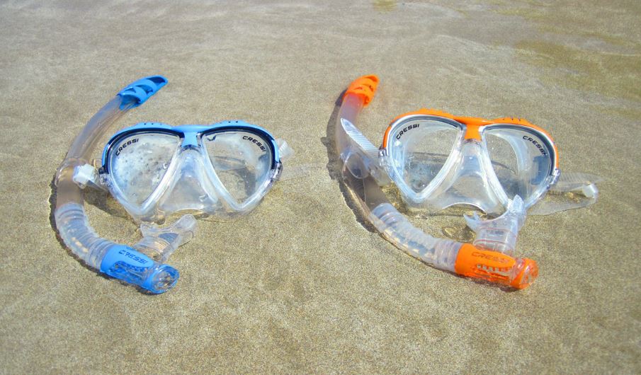 Two snorkeling goggles on the beach
