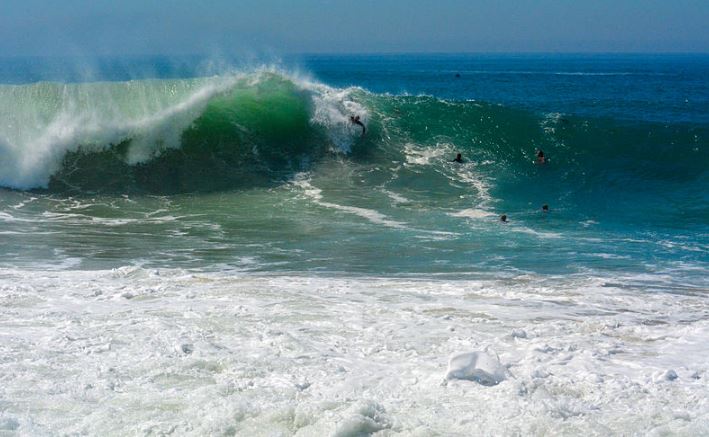 surfers bodysurfing in The Wedge in Newport Beach