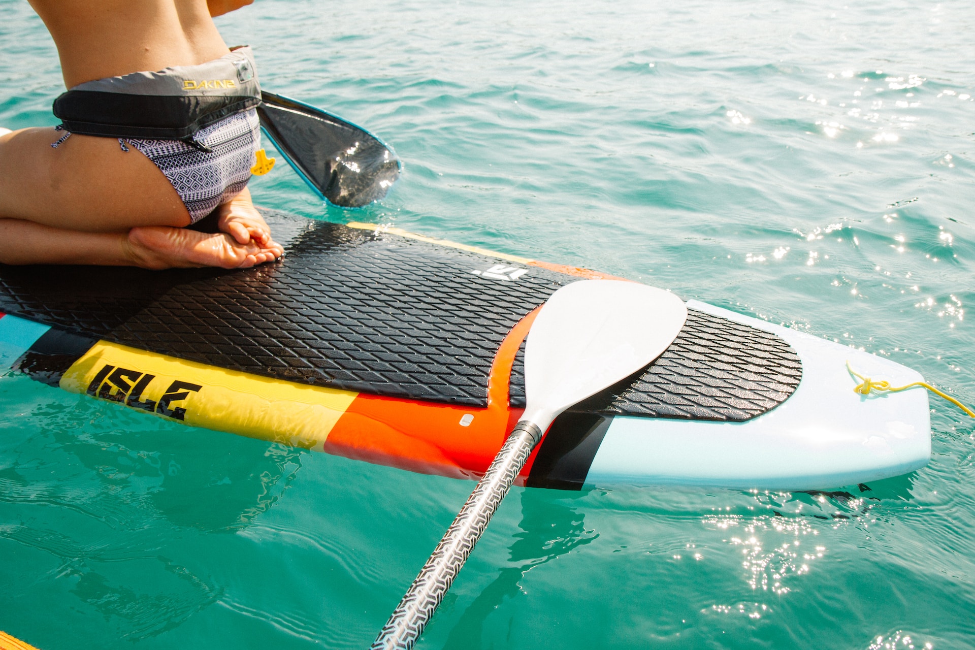 a multi-colored paddleboard